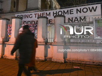 KRAKOW, POLAND - DECEMBER 20:   
A giant 'Bring Them Home Now' message, accompanied by images of people kidnapped by Hamas, is displayed at...