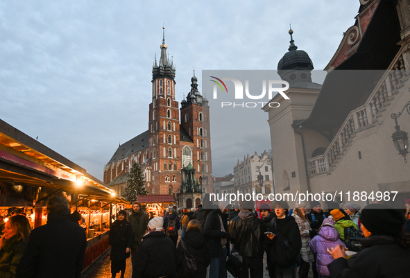 KRAKOW, POLAND - DECEMBER 20:   
A Christmas tree stands near St. Mary's Basilica in Krakow's UNESCO-listed Main Square on December 20, 2024...