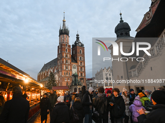 KRAKOW, POLAND - DECEMBER 20:   
A Christmas tree stands near St. Mary's Basilica in Krakow's UNESCO-listed Main Square on December 20, 2024...