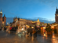 KRAKOW, POLAND - DECEMBER 20:   
Horse-drawn carriages waiting for tourists at Krakow's Main Market Square, on December 20, 2024 in Krakow,...