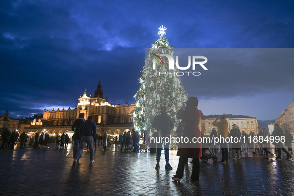 KRAKOW, POLAND - DECEMBER 20:   
An illuminated Christmas tree stands in Krakow's UNESCO-listed Main Square, on December 20, 2024 in Krakow,...