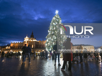 KRAKOW, POLAND - DECEMBER 20:   
An illuminated Christmas tree stands in Krakow's UNESCO-listed Main Square, on December 20, 2024 in Krakow,...