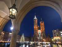 KRAKOW, POLAND - DECEMBER 20:   
An illuminated Christmas tree stands near St. Mary's Basilica in Krakow's UNESCO-listed Main Square, on Dec...