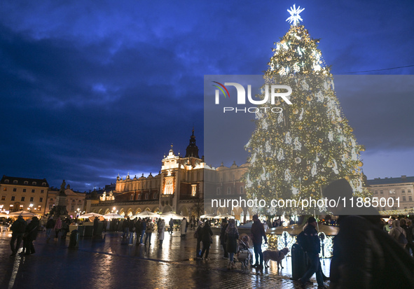 KRAKOW, POLAND - DECEMBER 20:   
An illuminated Christmas tree stands in Krakow's UNESCO-listed Main Square, on December 20, 2024 in Krakow,...