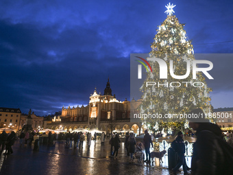 KRAKOW, POLAND - DECEMBER 20:   
An illuminated Christmas tree stands in Krakow's UNESCO-listed Main Square, on December 20, 2024 in Krakow,...