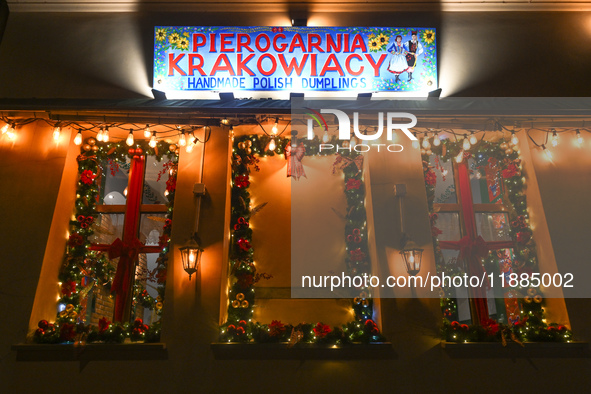 KRAKOW, POLAND - DECEMBER 20:   
A sign at the entrance to Pierogarnia 'Krakowiacy,' specializing in traditional Polish handmade dumplings,...