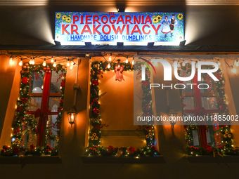 KRAKOW, POLAND - DECEMBER 20:   
A sign at the entrance to Pierogarnia 'Krakowiacy,' specializing in traditional Polish handmade dumplings,...