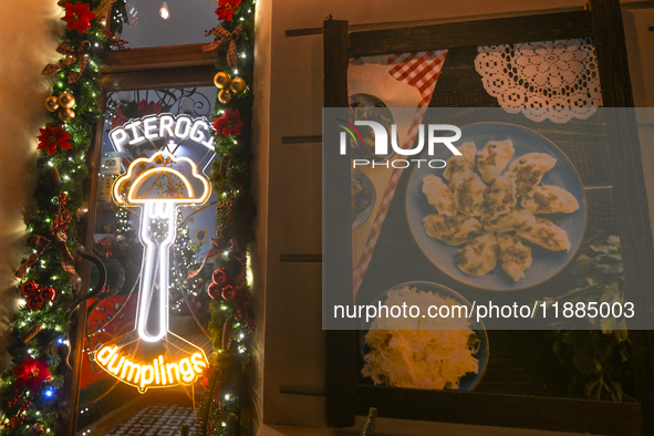 KRAKOW, POLAND - DECEMBER 20:   
A sign in the window of Pierogarnia 'Krakowiacy,' specializing in traditional Polish handmade dumplings, on...