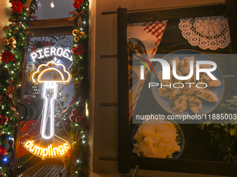 KRAKOW, POLAND - DECEMBER 20:   
A sign in the window of Pierogarnia 'Krakowiacy,' specializing in traditional Polish handmade dumplings, on...