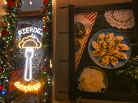 KRAKOW, POLAND - DECEMBER 20:   
A sign in the window of Pierogarnia 'Krakowiacy,' specializing in traditional Polish handmade dumplings, on...