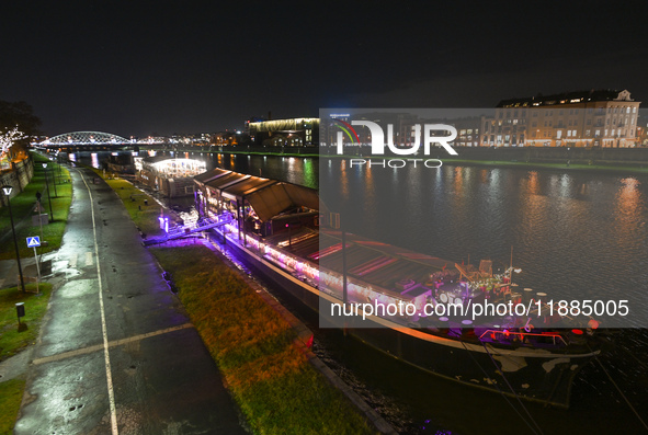 KRAKOW, POLAND - DECEMBER 20:   
Festively decorated riverboats, docked along the Vistula River in Krakow, on December 20, 2024 in Krakow, P...