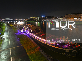 KRAKOW, POLAND - DECEMBER 20:   
Festively decorated riverboats, docked along the Vistula River in Krakow, on December 20, 2024 in Krakow, P...