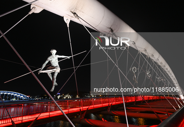 KRAKOW, POLAND - DECEMBER 20:   
View of Krakow's Father Bernatek Footbridge, illuminated for the Christmas holidays, on December 20, 2024 i...