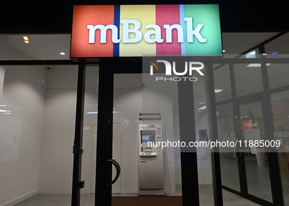 KRAKOW, POLAND - DECEMBER 20:   
The mBank logo displayed at the entrance to a bank office,, on December 20, 2024 in Krakow, Poland. 