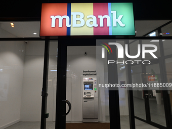 KRAKOW, POLAND - DECEMBER 20:   
The mBank logo displayed at the entrance to a bank office,, on December 20, 2024 in Krakow, Poland. (