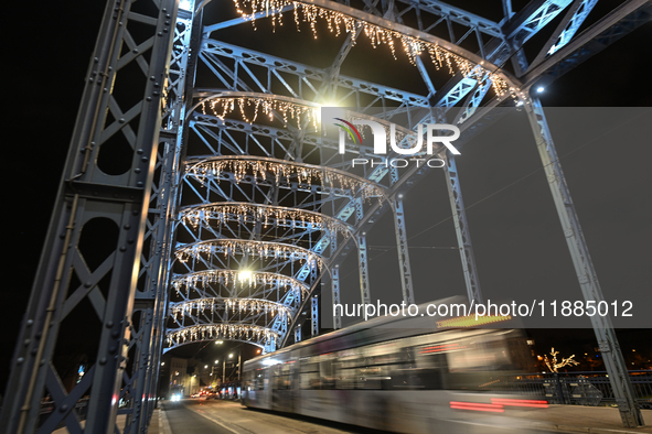 KRAKOW, POLAND - DECEMBER 20:   
A view of the Jozef Pilsudski Bridge decorated for Christmas season, on December 20, 2024 in Krakow, Poland...