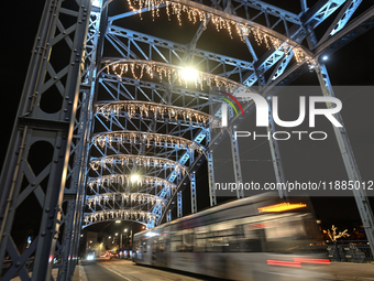 KRAKOW, POLAND - DECEMBER 20:   
A view of the Jozef Pilsudski Bridge decorated for Christmas season, on December 20, 2024 in Krakow, Poland...