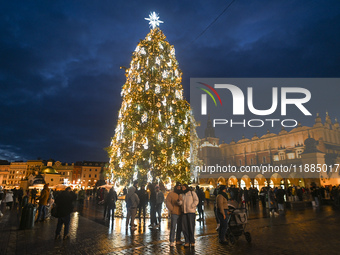 KRAKOW, POLAND - DECEMBER 20:   
An illuminated Christmas tree stands in Krakow's UNESCO-listed Main Square, on December 20, 2024 in Krakow,...