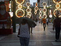 Pedestrians face strong storms in the center of Sao Paulo, Brazil, on December 20, 2024, this Friday afternoon. (