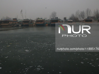 A frozen portion of Dal Lake is seen in Srinagar, Jammu and Kashmir, on December 21, 2024. The 40-day harsh winter period, locally referred...