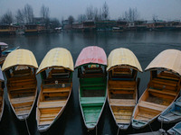 Shikara boats are moored to the bank of Dal Lake in Srinagar, Jammu and Kashmir, on December 21, 2024. The 40-day harsh winter period, local...