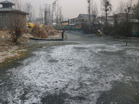 A frozen portion of Dal Lake is seen in Srinagar, Jammu and Kashmir, on December 21, 2024. The 40-day harsh winter period, locally referred...