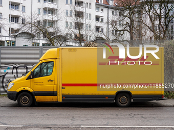 A DHL delivery vehicle parks in a residential area in Munich, Bavaria, Germany, on December 20, 2024 (