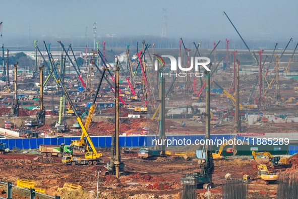 Pile driving operation takes place at the construction site of the Nanjing North Station Hub Project in Nanjing, China, on December 21, 2024...