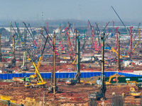 Pile driving operation takes place at the construction site of the Nanjing North Station Hub Project in Nanjing, China, on December 21, 2024...