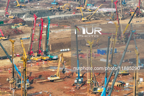 Pile driving operation takes place at the construction site of the Nanjing North Station Hub Project in Nanjing, China, on December 21, 2024...