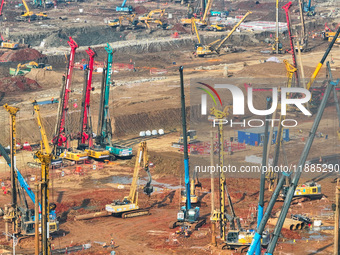 Pile driving operation takes place at the construction site of the Nanjing North Station Hub Project in Nanjing, China, on December 21, 2024...