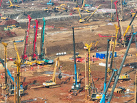 Pile driving operation takes place at the construction site of the Nanjing North Station Hub Project in Nanjing, China, on December 21, 2024...