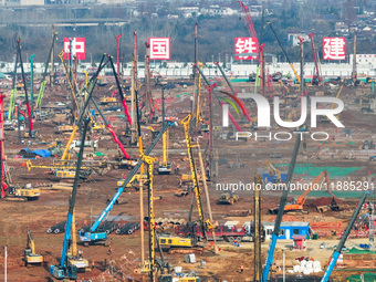 Pile driving operation takes place at the construction site of the Nanjing North Station Hub Project in Nanjing, China, on December 21, 2024...