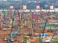 Pile driving operation takes place at the construction site of the Nanjing North Station Hub Project in Nanjing, China, on December 21, 2024...