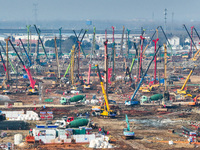 Pile driving operation takes place at the construction site of the Nanjing North Station Hub Project in Nanjing, China, on December 21, 2024...