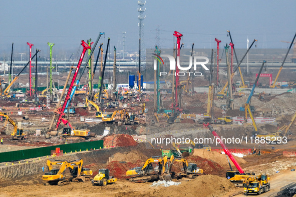 Pile driving operation takes place at the construction site of the Nanjing North Station Hub Project in Nanjing, China, on December 21, 2024...