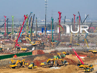 Pile driving operation takes place at the construction site of the Nanjing North Station Hub Project in Nanjing, China, on December 21, 2024...