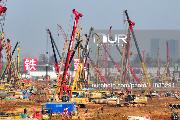 Pile driving operation takes place at the construction site of the Nanjing North Station Hub Project in Nanjing, China, on December 21, 2024...