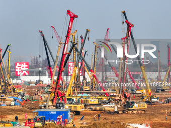 Pile driving operation takes place at the construction site of the Nanjing North Station Hub Project in Nanjing, China, on December 21, 2024...