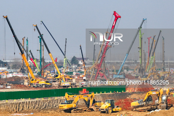 Pile driving operation takes place at the construction site of the Nanjing North Station Hub Project in Nanjing, China, on December 21, 2024...