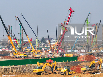 Pile driving operation takes place at the construction site of the Nanjing North Station Hub Project in Nanjing, China, on December 21, 2024...