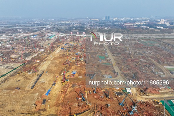 Pile driving operation takes place at the construction site of the Nanjing North Station Hub Project in Nanjing, China, on December 21, 2024...