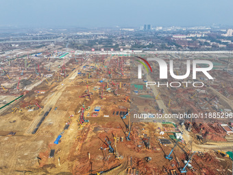 Pile driving operation takes place at the construction site of the Nanjing North Station Hub Project in Nanjing, China, on December 21, 2024...