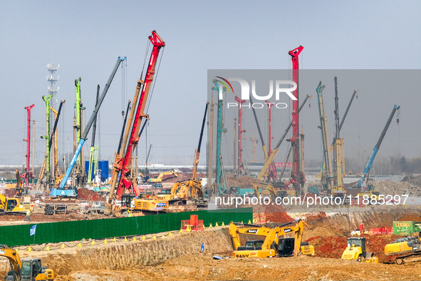 Pile driving operation takes place at the construction site of the Nanjing North Station Hub Project in Nanjing, China, on December 21, 2024...