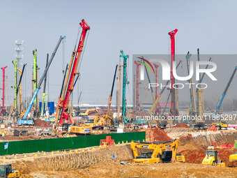 Pile driving operation takes place at the construction site of the Nanjing North Station Hub Project in Nanjing, China, on December 21, 2024...