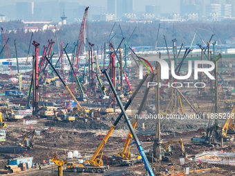 Pile driving operation takes place at the construction site of the Nanjing North Station Hub Project in Nanjing, China, on December 21, 2024...