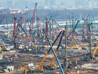 Pile driving operation takes place at the construction site of the Nanjing North Station Hub Project in Nanjing, China, on December 21, 2024...