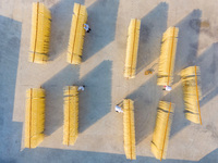 A worker places hanging noodles on a shelf to dry in Hefei, Anhui province, China, on December 21, 2024. (