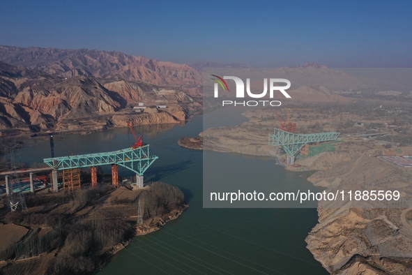 An aerial photo shows the construction of the Jianzha Yellow River Bridge, a key project of the Sichuan-Qinghai Railway in Jianzha County, Q...