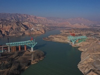 An aerial photo shows the construction of the Jianzha Yellow River Bridge, a key project of the Sichuan-Qinghai Railway in Jianzha County, Q...